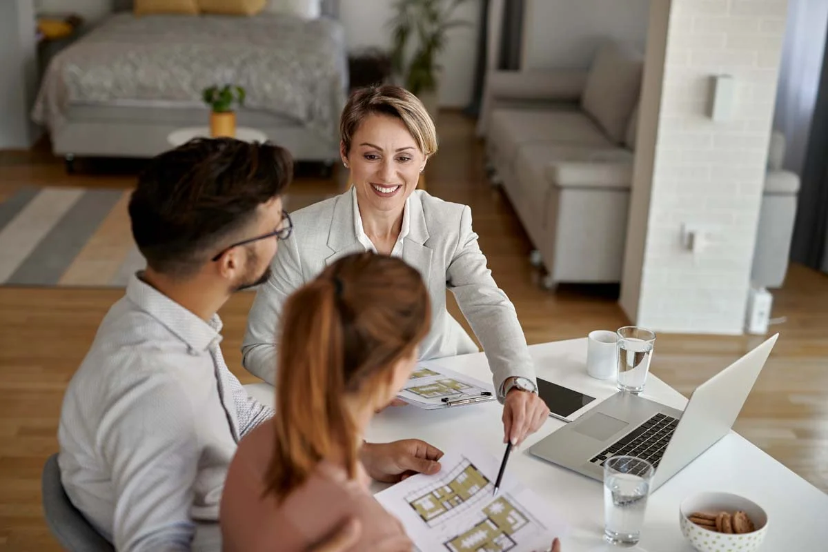 A property manager and owners discussing Airbnb property management fees