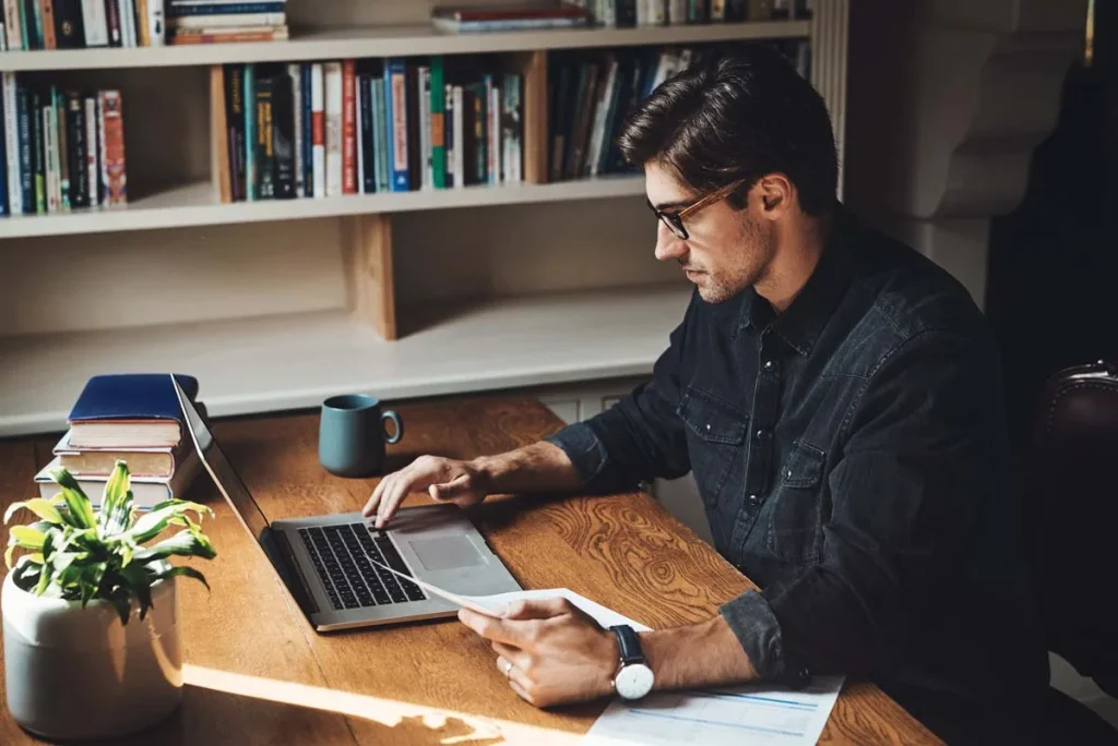 A property owner carefully reviewing an Airbnb Management Agreement