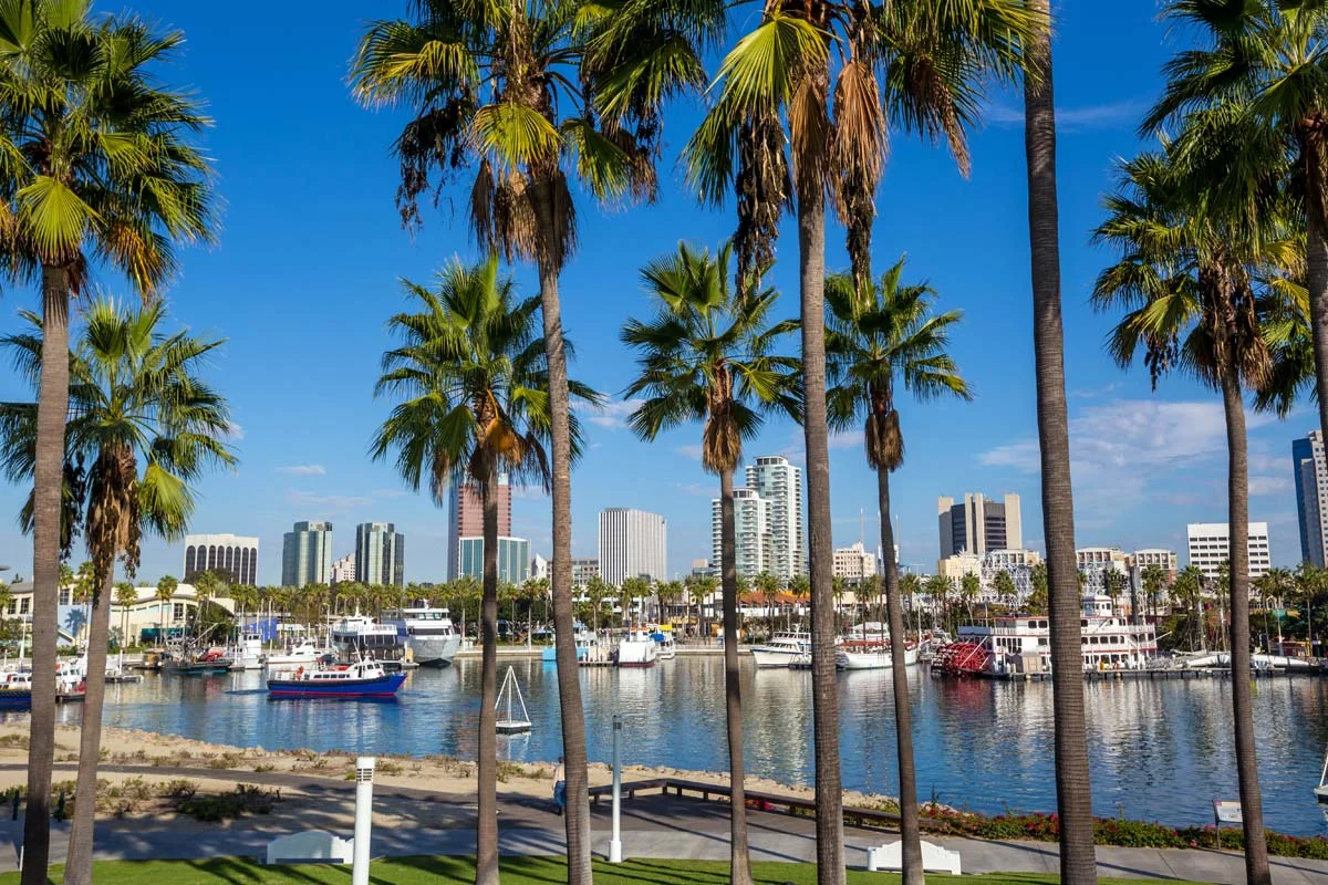 Sunny view of the Long Beach California coastline and city skyline to highlight short term rentals in Long Beach
