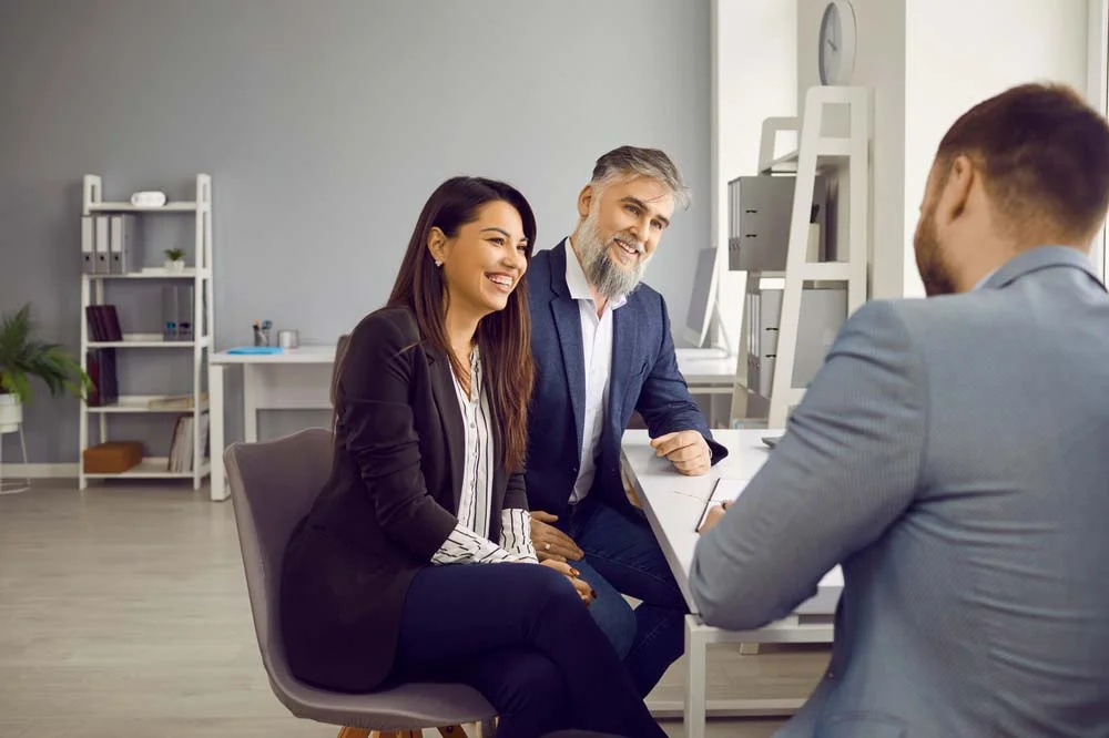 Airbnb manager discussing Airbnb management fees with a property owner during a meeting