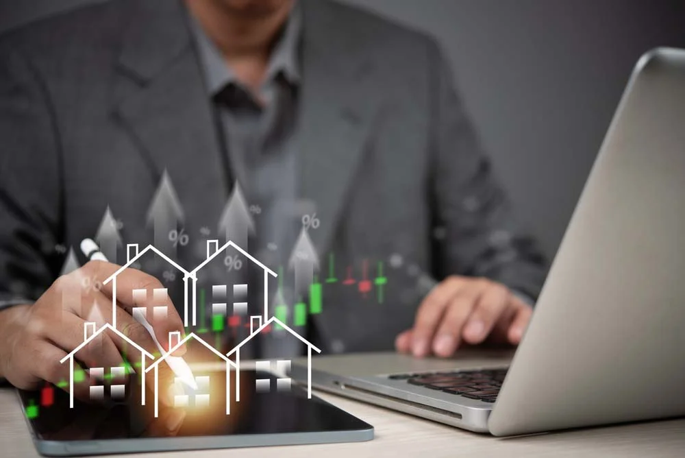 A hand pointing to a digital chart showing high occupancy rate Los Angeles and dynamic pricing fluctuations on a mobile device, representing smart Airbnb property management