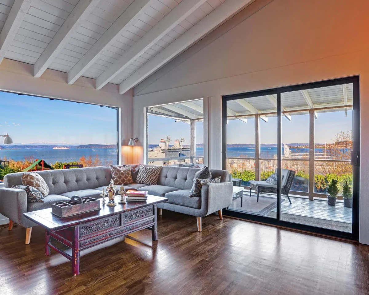 A bright and modern furnished living room in a coastal home