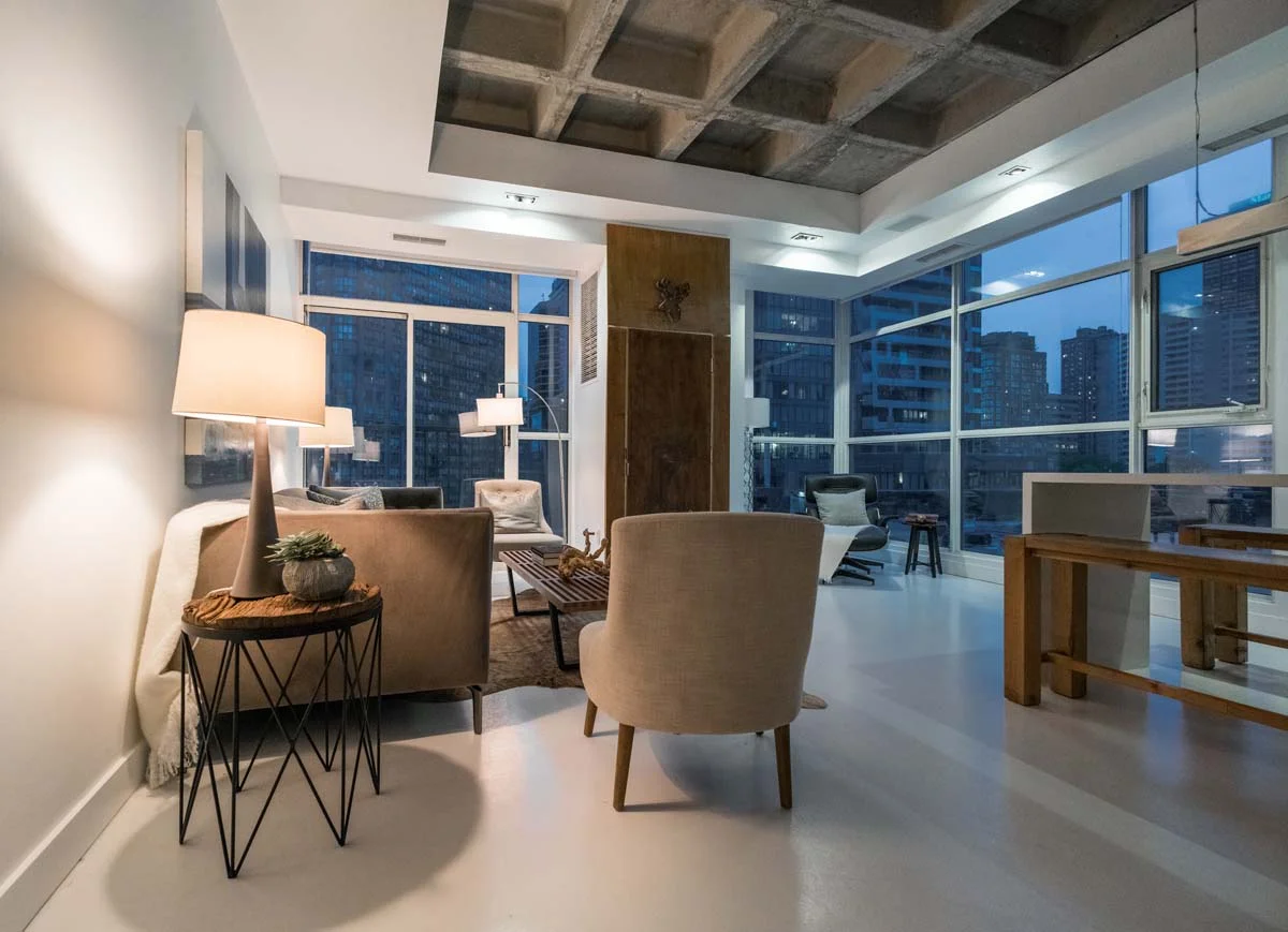 A luxury condo interior with a modern living room and a city view