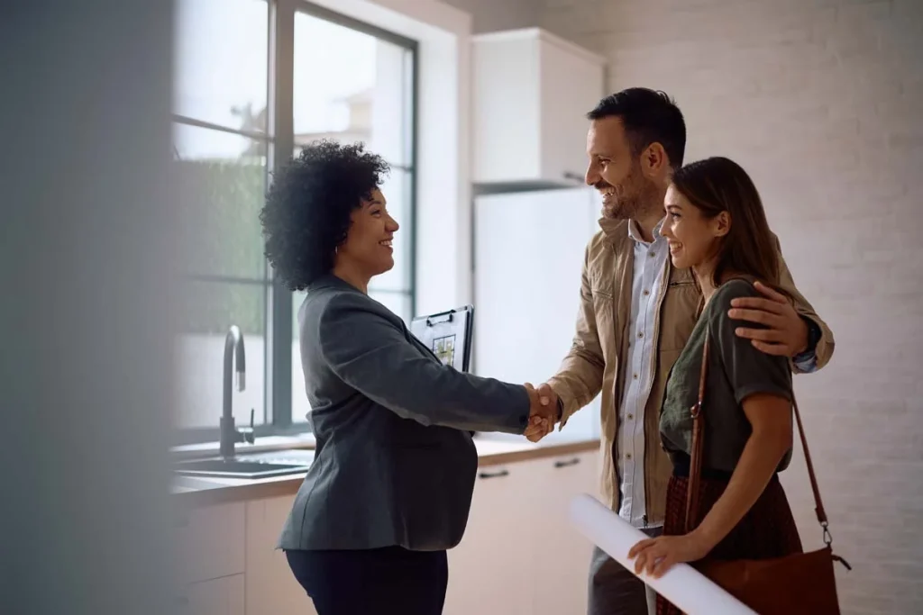 A property owner and an Airbnb management expert shaking hands to begin a partnership