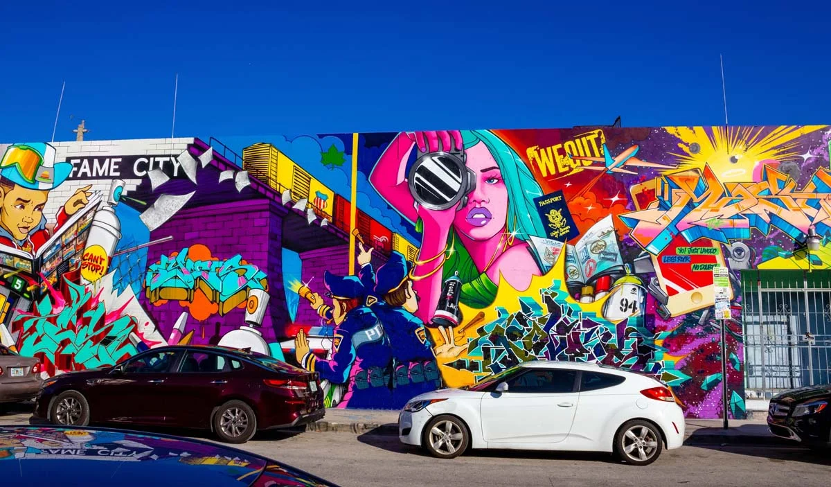 A street in the Wynwood Art District of Miami with famous wall murals and walkable sidewalks