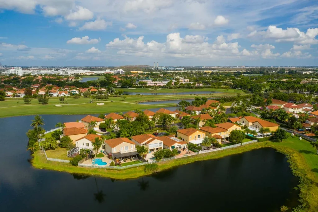 Aerial view of a peaceful residential community in Pembroke Pines Florida with lush greenery and local lakes