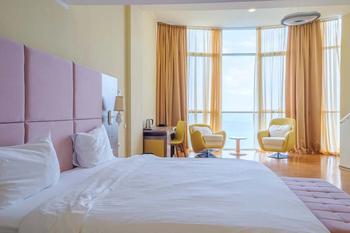 Interior view of a modern luxury condo with an ocean view, perfect for Airbnb guests