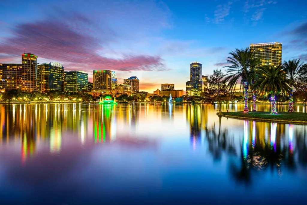 The bright city lights and skyline on Eola Lake, Orlando, Florida