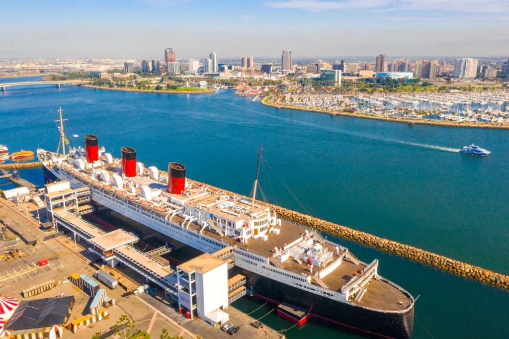 The historic Queen Mary ship docked in Long Beach harbor, a major attraction for short-term rental guests