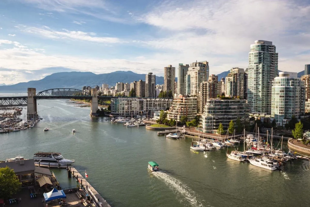 View of Downtown Vancouver and Burrard Bridge at False Creek, British Columbia (BC), Canada, during a sunny evening