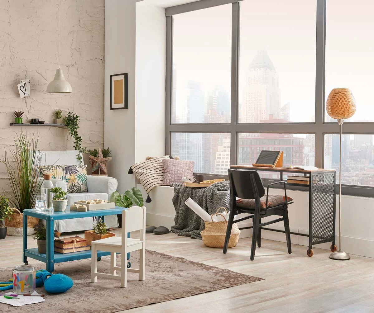 A modern and cozy furnished rental interior with a city view