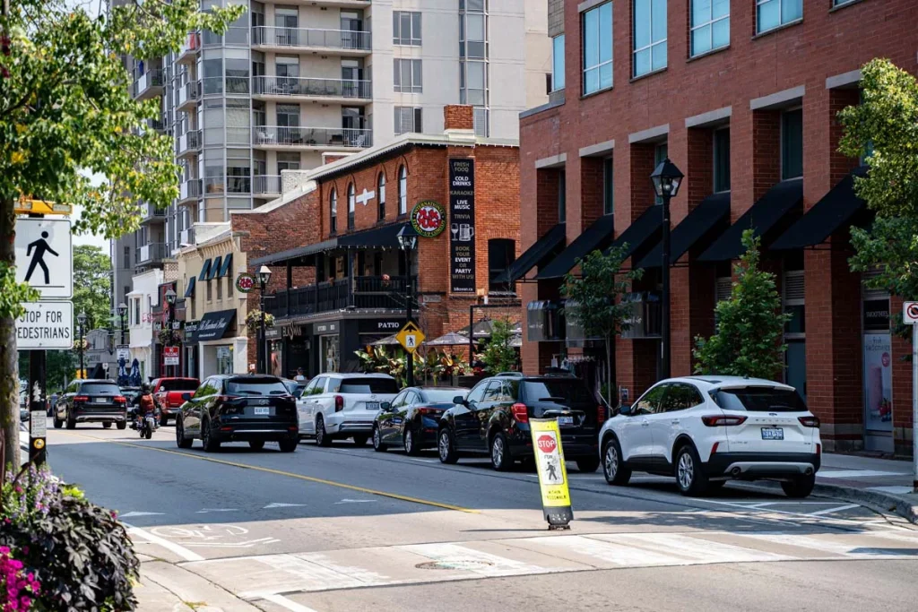 A pedestrian-friendly street in downtown Burlington, Ontario, featuring local shops and cafes