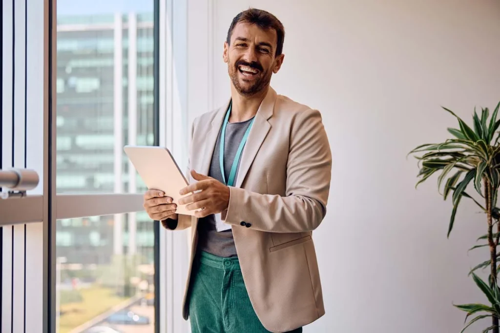 A property manager using a digital tablet to manage vacation rental bookings and guest communication