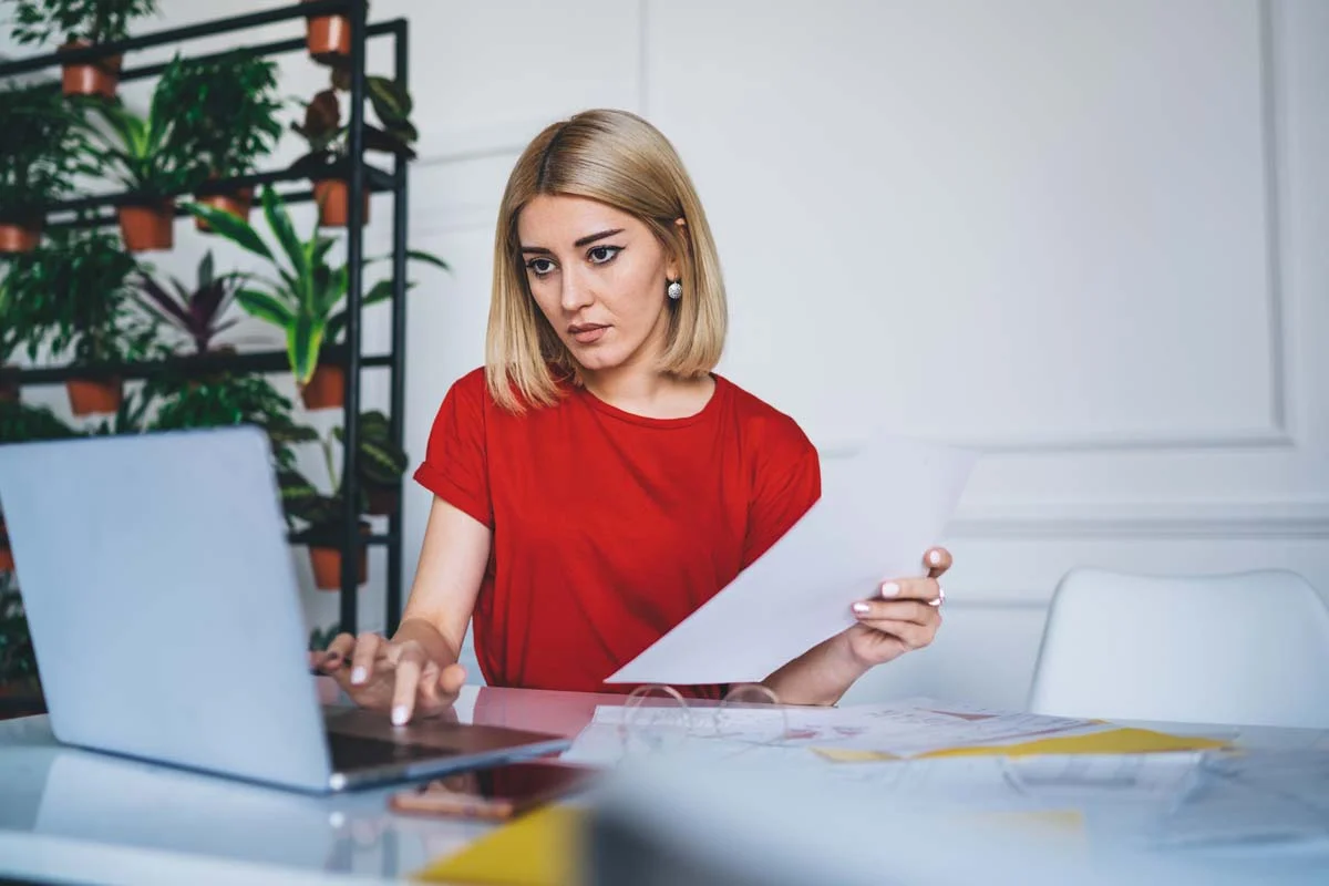 A property owner reviewing a Bellevue short term rental permit and local regulations on a laptop