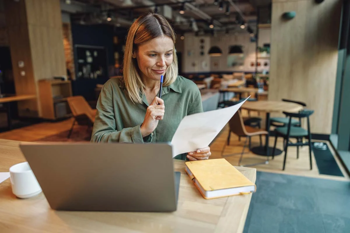 A property owner using a laptop to complete Seattle rental housing registration online