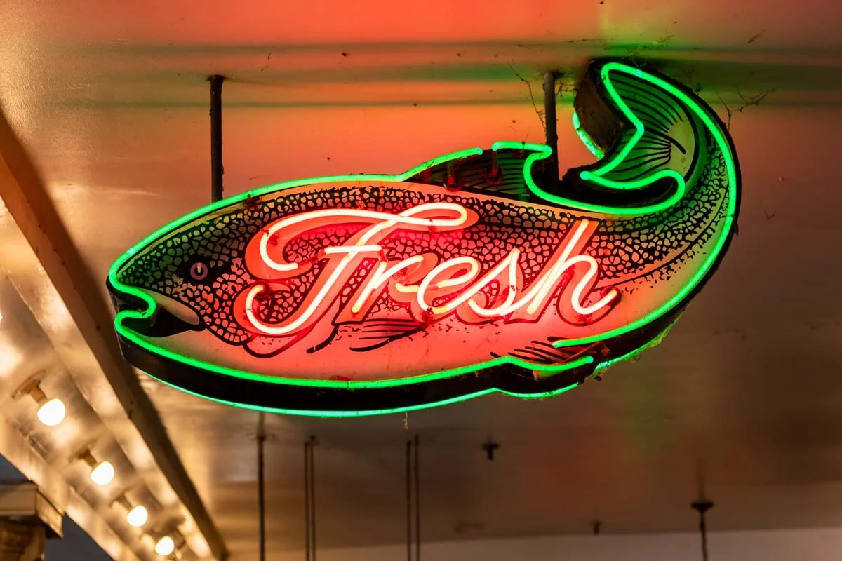 Fresh fish neon sign at a food market in Seattle