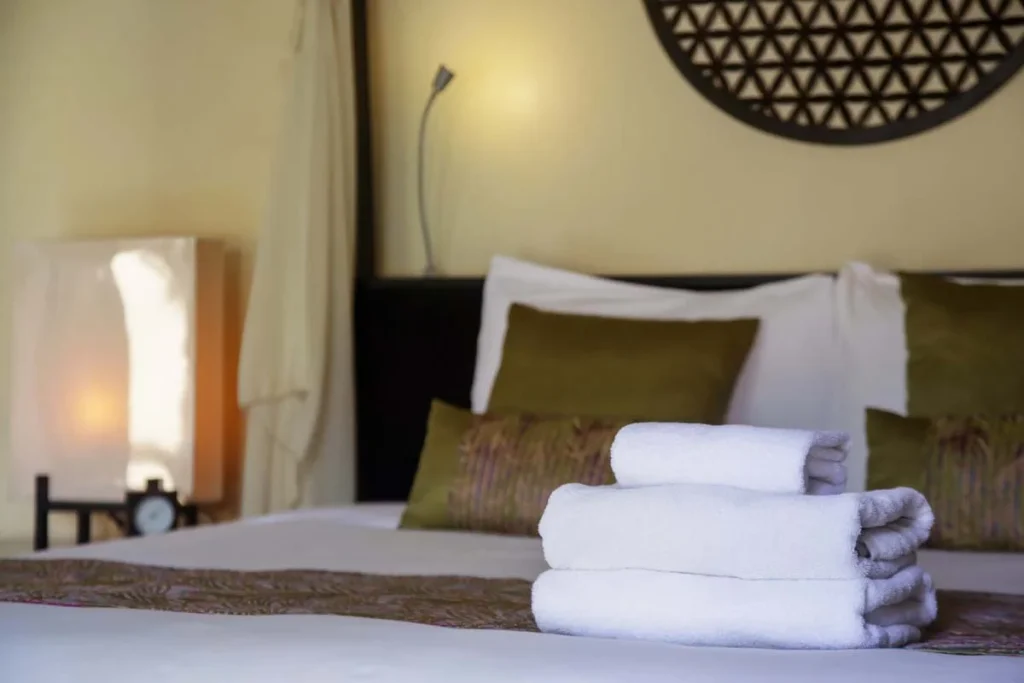 Fresh white towels and guest amenities prepared by an Airbnb management service for new arrivals