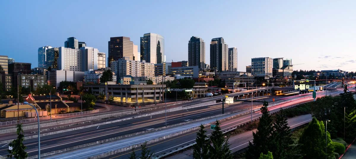 Modern city skyline of Bellevue Washington featuring high-rise buildings and tech hub architecture for Bellevue short term rentals
