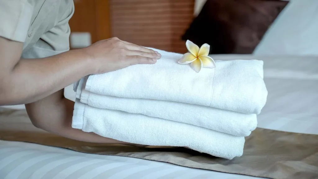 Neatly folded towels and guest amenities in a professionally managed Airbnb