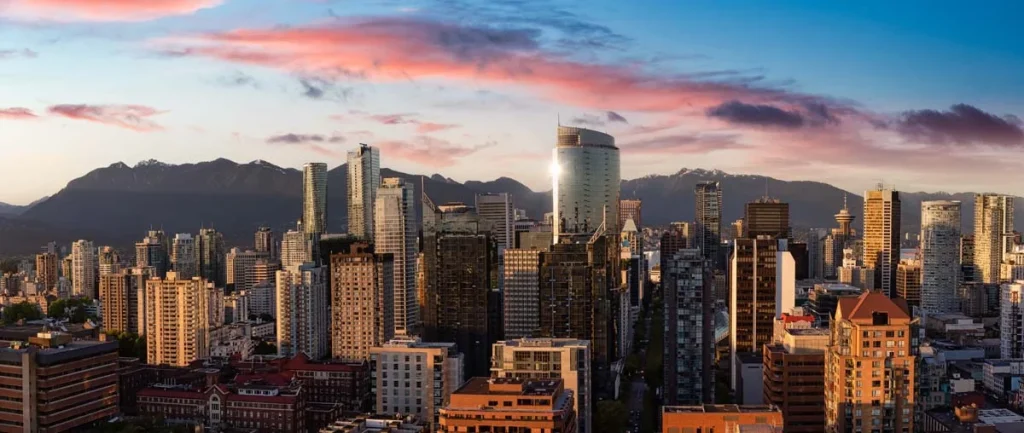 Panoramic view of the Vancouver city skyline with the mountains in the background