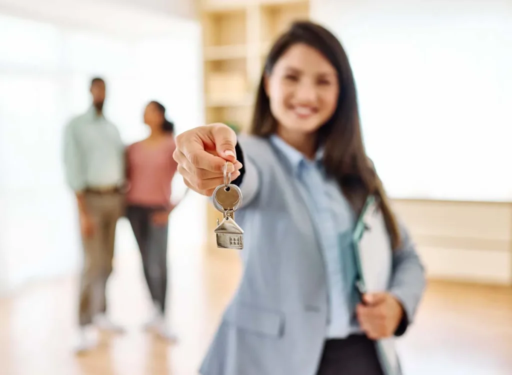 Property manager holding keys to a vacation rental home