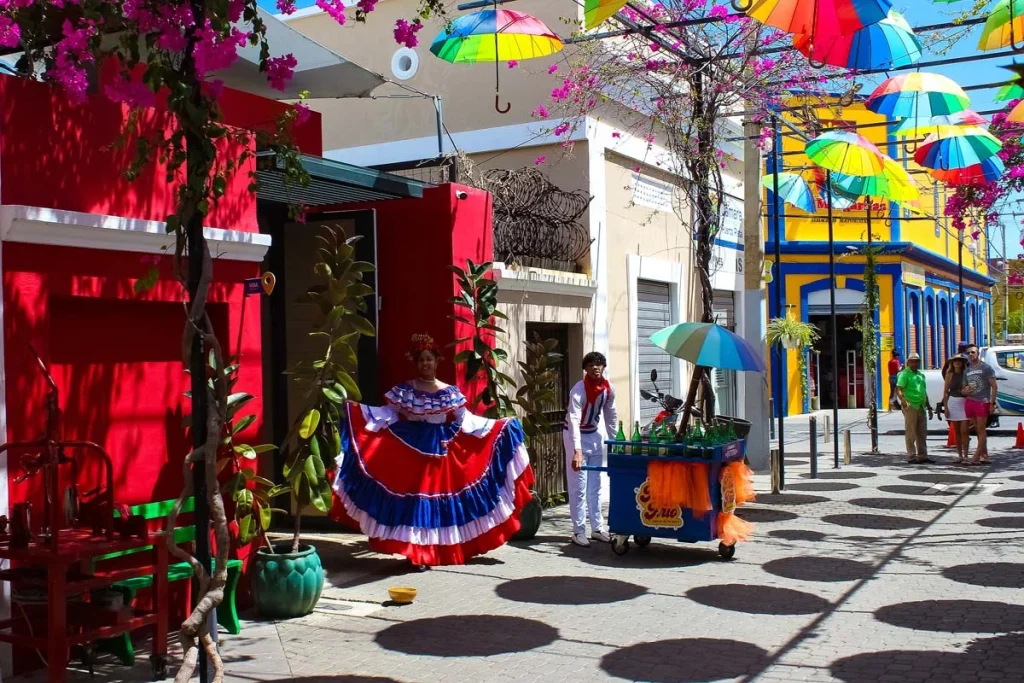 A bright street in Santo Domingo with colorful buildings and historic architecture.