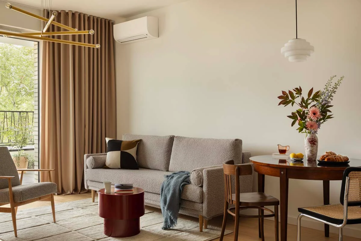 A cozy and modern living room inside a clean short term rental