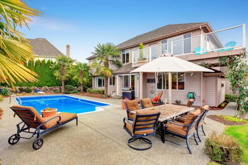 A luxury Scottsdale Airbnb with a pool and desert landscaping to represent the best Airbnb in Scottsdale