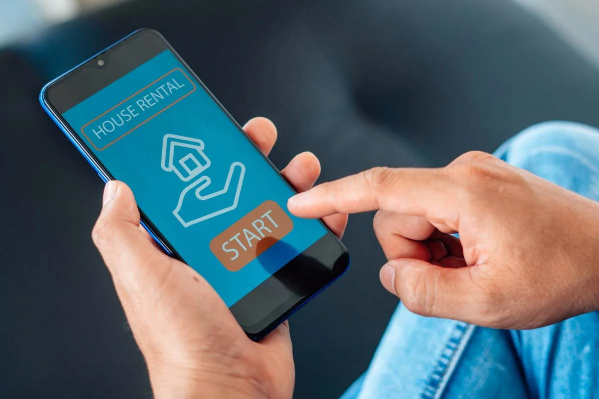 A person using a mobile app for short term rental property management services in Las Vegas