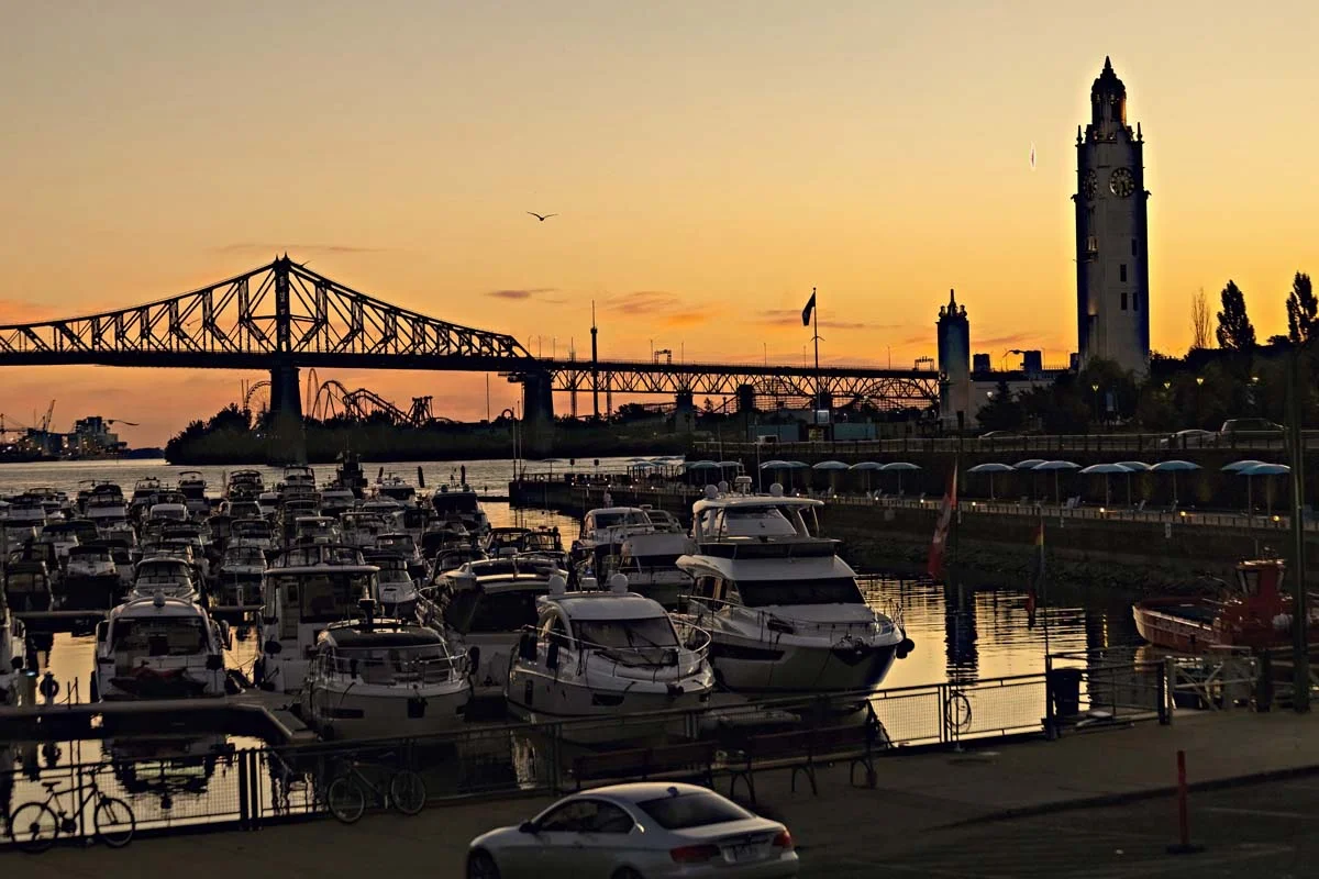 Beautiful Sunrise in Old Port, clock tower and Jacques Cartier Bridge against sunset sky, Montreal, Canada