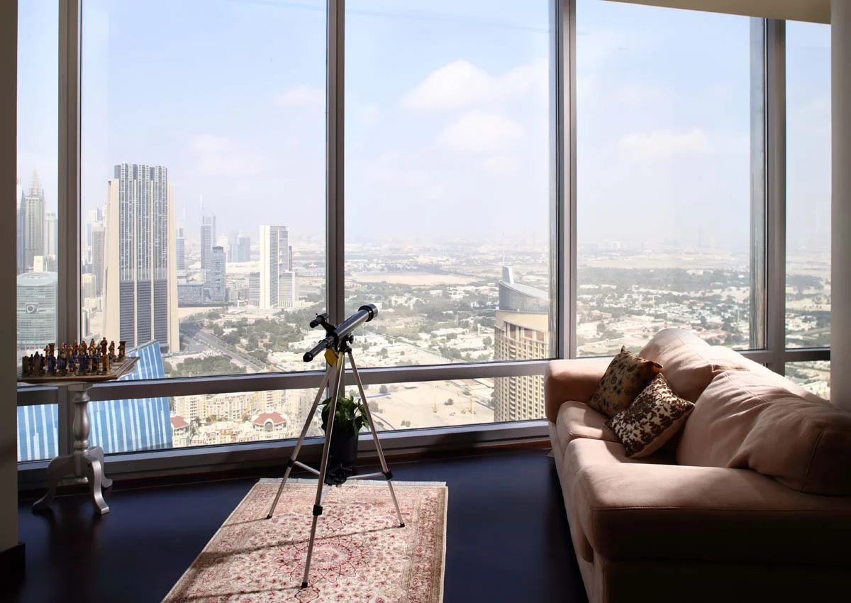 Modern luxury apartment living room with a view of city skyscrapers