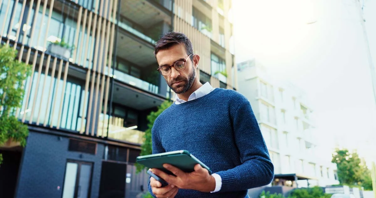 Owner of a new multi-story apartment building ready for rental residents