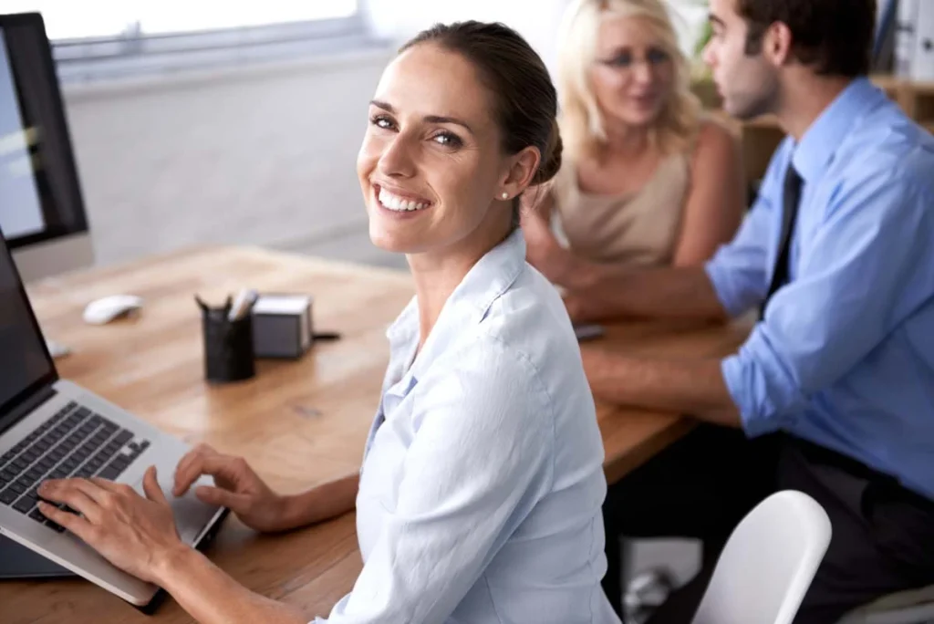 Professional Airbnb property manager smiling warmly, ready to help property owners with their rental business