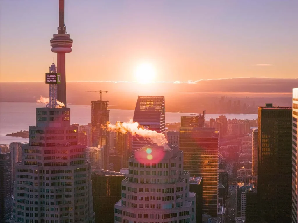The Toronto city skyline at sunset featuring the CN Tower