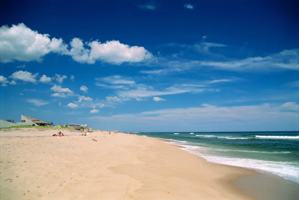 White sand and blue sea of the Main Beach in East Hampton, NY