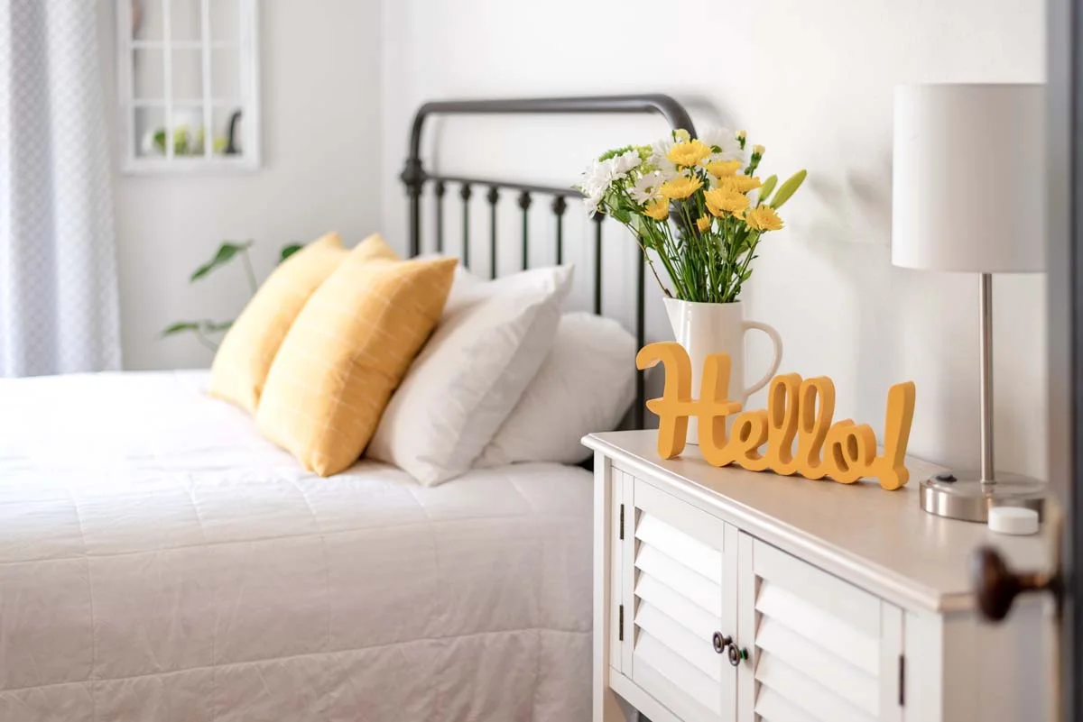 A clean and professionally styled bedroom in a managed vacation rental home