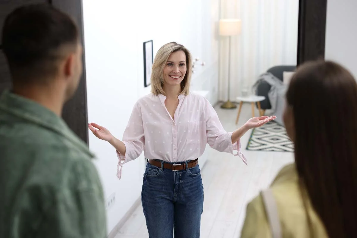 A local host welcoming guests into their primary residence for a homesharing stay