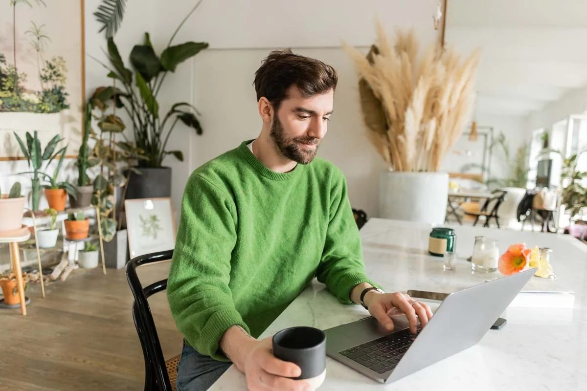 A person using a laptop to look up local city rules and permit information