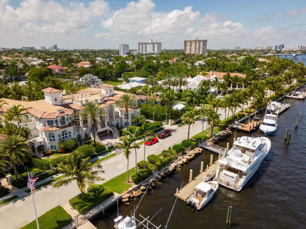 Aerial view of waterfront luxury homes and winding canals in Fort Lauderdale, Florida