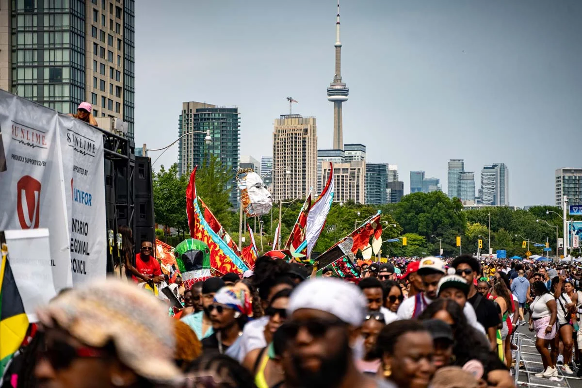 Caribana Festival Toronto parade with the CN Tower in the background