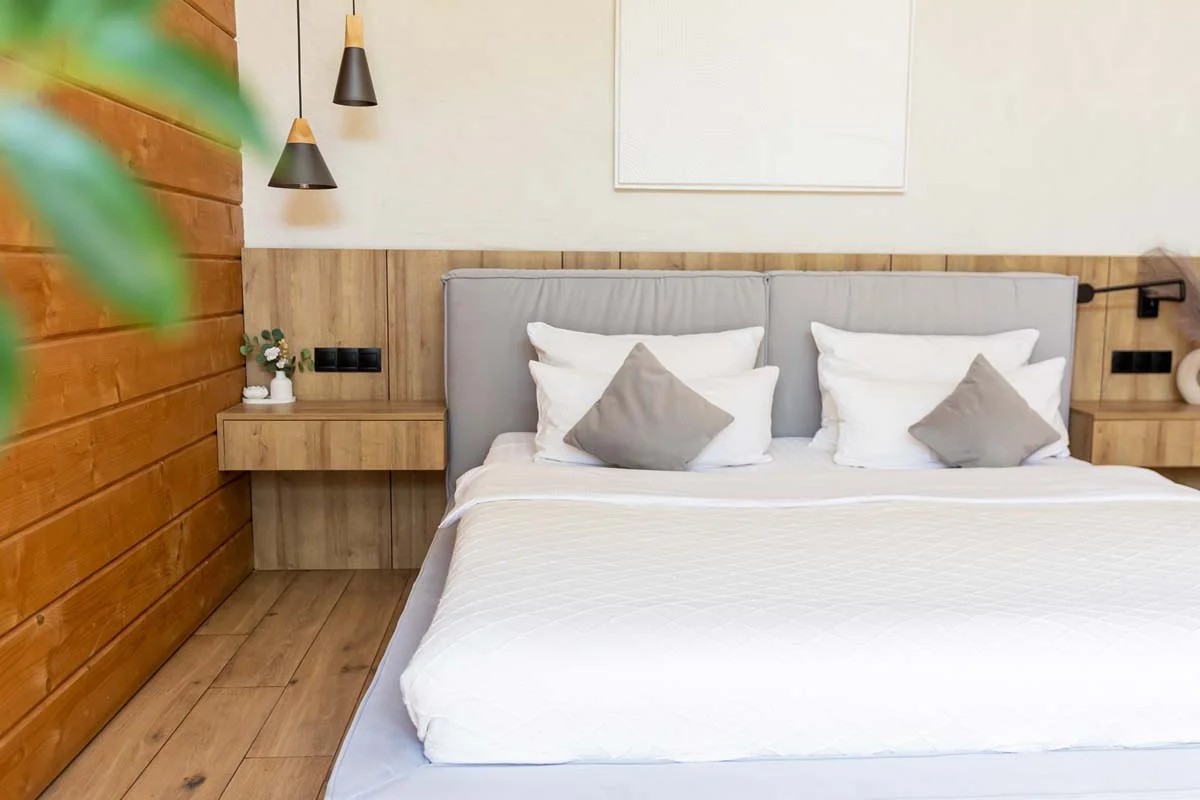 A neatly styled short-term rental bedroom prepared for arriving guests