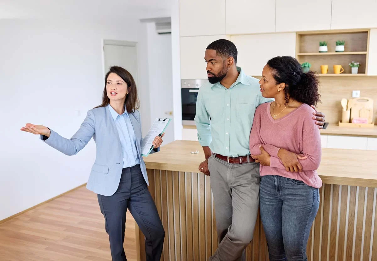 A professional property manager welcoming guests in a clean and modern short term rental apartment