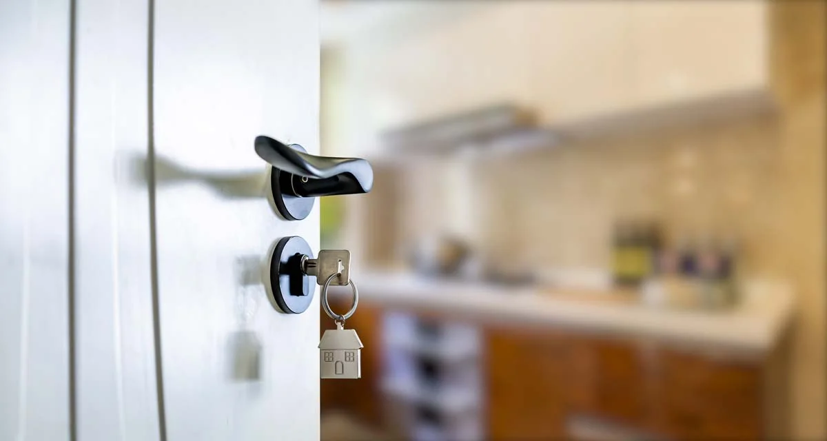 An Open door with keys, representing working with a reputable professional property management company