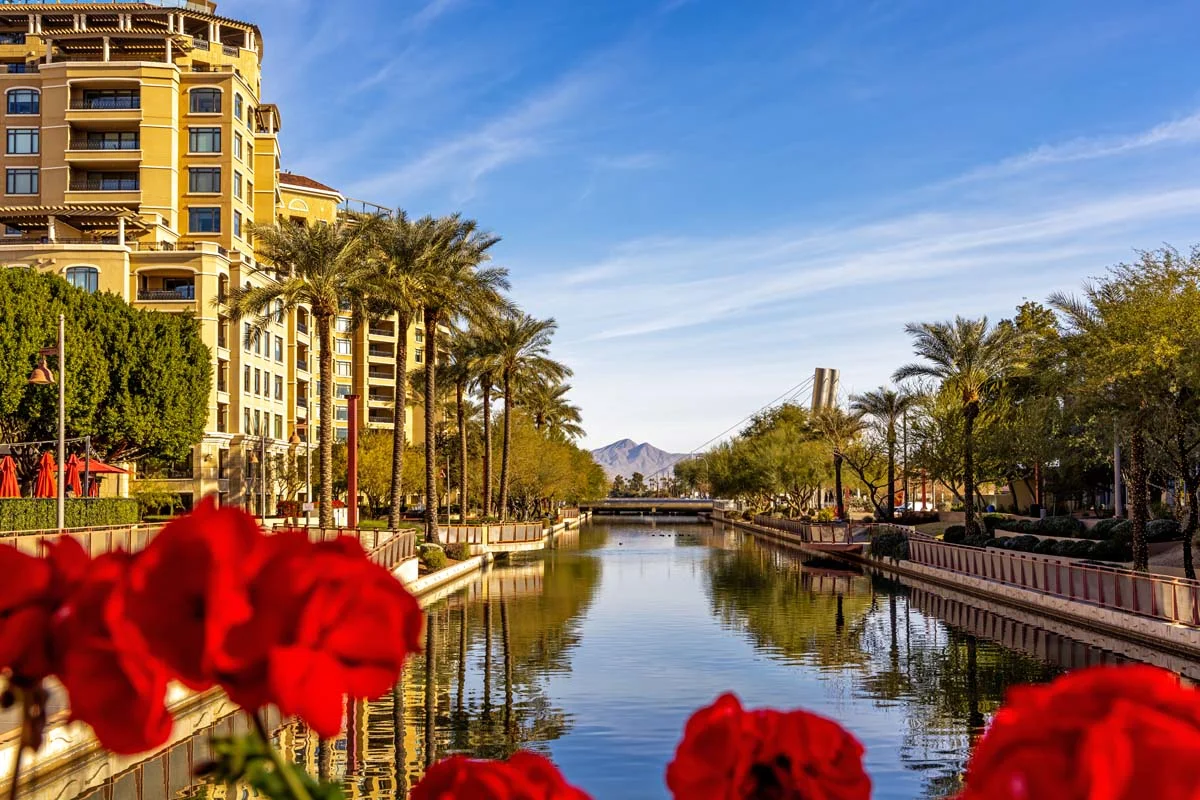 Daytime scene of canal running through waterfront district of Old Town Scottsdale, Arizona, USA with condo housing, retail and restaurants