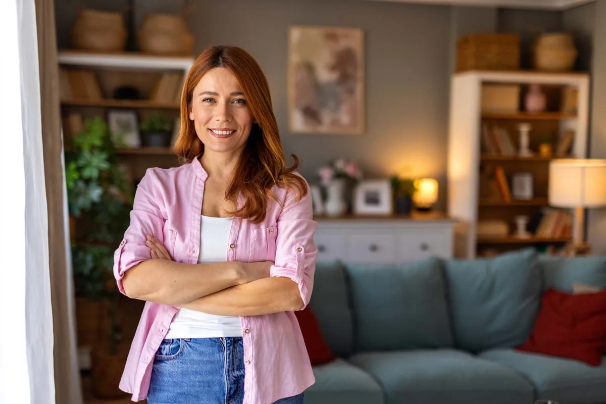 Homeowner in a pristine and well-decorated living room of a short-term rental home