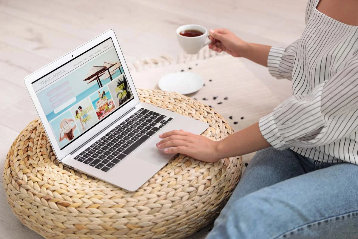 Person searching for vacation accommodations on a laptop screen