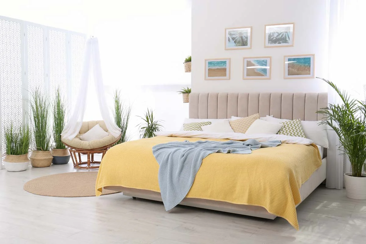 Professionally staged luxury vacation rental bedroom with clean white linens and bright decor