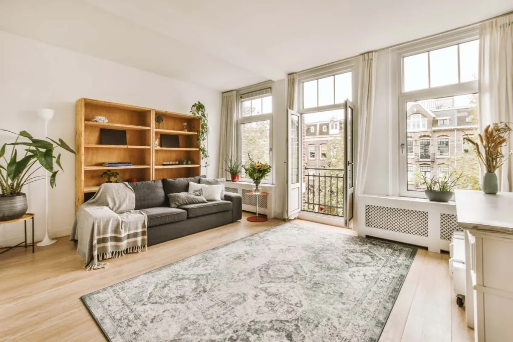 A bright and modern furnished living room representing mid-term rental management services