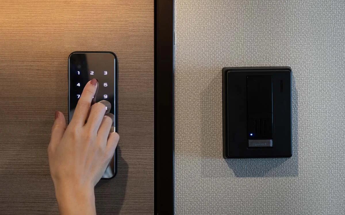 A modern digital smart lock on a front door for automated guest check-in