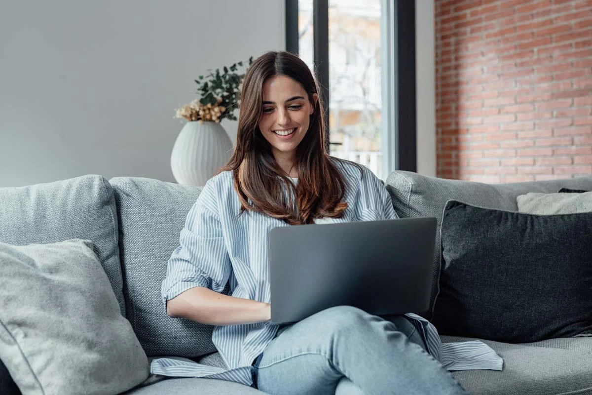 Airbnb host managing guest communication and calendar bookings on a laptop